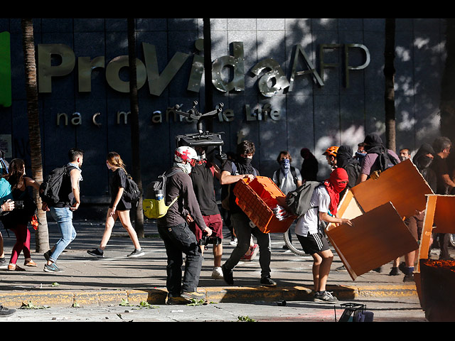 Массовые протесты в Чили: три недели хаоса. Фоторепортаж