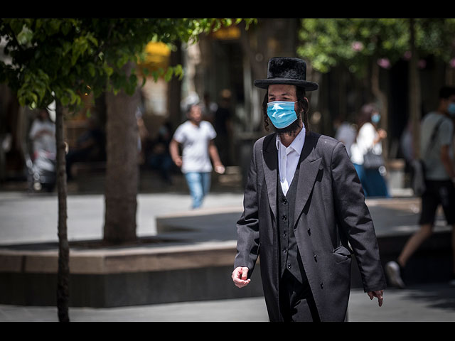 Власти Израиля ужесточают карантинные меры: за отсутствие масок будут штрафовать. Фоторепортаж
