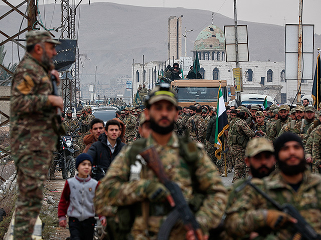 Сирия празднует первую годовщину свержения Башара Асада. Фоторепортаж