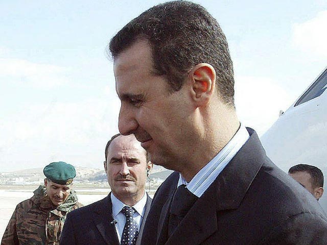 Time: Уготована ли Башару Асаду участь Муаммара Каддафи?