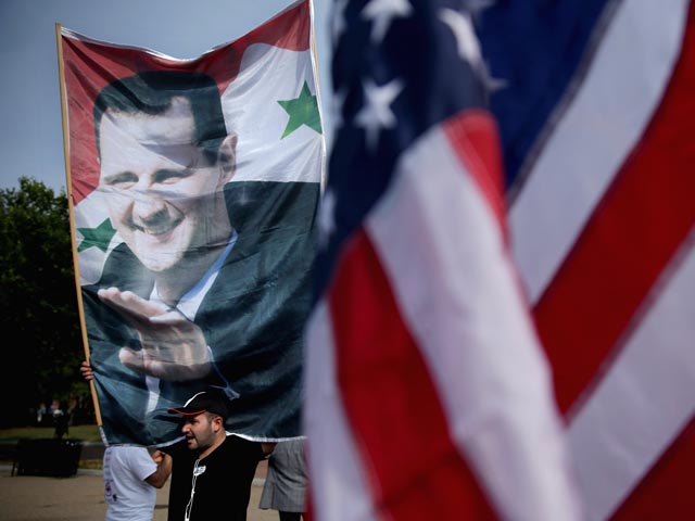 Башар Асад: угрозы США не повлияли на решение о международном контроле над ОМП 
