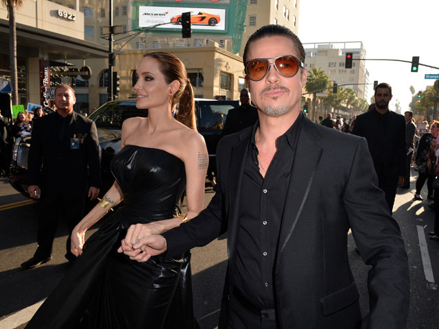 Анджелина Джоли и Брэд Питт на премьере фильма "Малефисента" 28 мая 2014 года