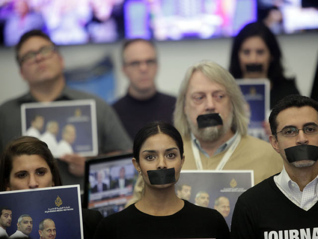 Сотрудники Al Jazeera America во время акции "Журнализм &#8211; не преступление"