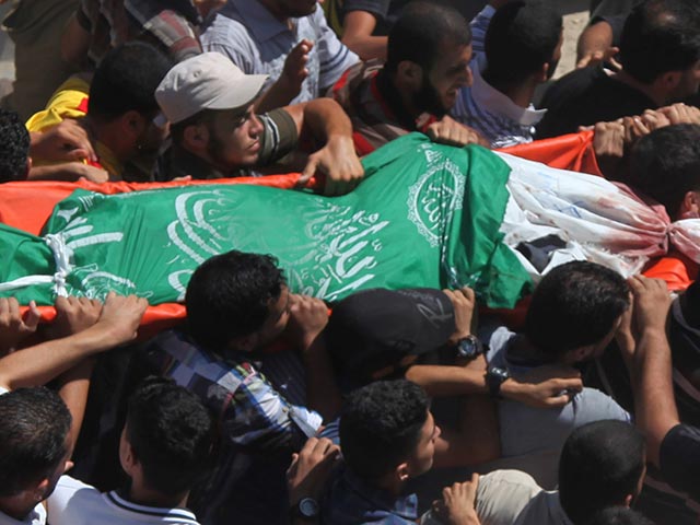 "Автомобильного террориста" похоронили около Рамаллы, завернутым во флаг ХАМАС  (иллюстрация) 