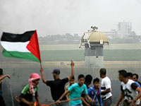 Арабы установили флаг на разделительном заборе с сектором Газы  