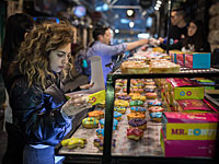 Израиль отмечает праздник Света и пончиков. Фоторепортаж