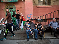 В Шуафате вывесили палестинские флаги с фотографией Фади Абу Шахайдама, совершившего теракт в Иерусалиме