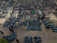 Опознание тел жителей городка Буча после убийства, перед отправкой в морг, 6 апреля 2022 года