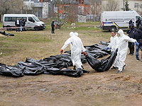 Эксгумация тел из братской могилы в Буче, Киевская область. 8 апреля 2022 года