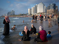 Дни "праздника жертвоприношения" на пляжах Израиля. Фоторепортаж
