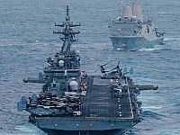 КСИР утверждает, что повредил американские авианосец и эсминец. США это отрицают