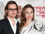 Брэд Питт и Анджелина Джоли на церемонии в Париже. 16 февраля 2012 года