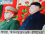Запуск "юбилейного" спутника в КНДР. Фото из телевизионного магазина в Сеуле