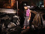 После обстрела цели на автомобильном рынке в районе Зейтун. Газа, 20 июня 2012 года