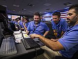 Сотрудники NASA следят за посадкой Curiosity