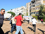 После прямого попадания ракеты в жилой дом в Кирьят-Малахи. 15 ноября 2012 года