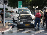 Автомобиль, сгоревший в Холоне после падения осколка ракеты. 18 ноября 2012 года