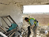 После прямого попадания ракеты в жилой дом в Кирьят-Малахи. 15 ноября 2012 года  