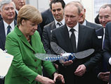 Владимир Путин и Ангела Меркель на индустриальной выставке в Ганновере. 8 апреля 2013 года