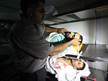 Убитые Робин аль-Фаиз Заид (28) и Юнис Джихад Абу аш-Шейх Джахджух (19). Морг больницы в Рамалле, 26 августа 2013 года