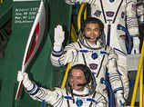 Российские космонавты вынесли Олимпийский факел в открытый космос