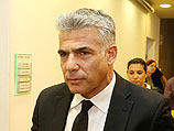 Министр финансов Яир Лапид перед еженедельной правительственной конференцией 27 апреля 2014 г.