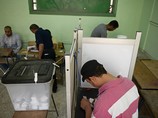 Голосование на избирательном участке в пригороде Каира. 27 мая 2014 г.