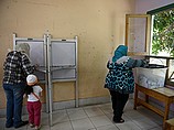 Голосование на избирательном участке в пригороде Каира. 27 мая 2014 г.