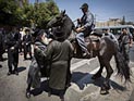 Ультраортодоксы митингуют в Иерусалиме, в трамвай брошены камни
