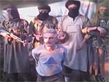 Кадр видеозаписи казни Эрве-Пьера Гурделя, распространенной боевиками "Исламского государства" 24 сентября 2014 года