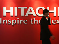 Компания Hitachi выпускает прибор, способный измерить уровень счастья рабочего коллектива  