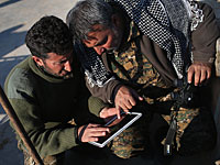 Курдские командиры сирийских демократических сил координируют передвижения войск на передовой