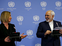 Верховный представитель Евросоюза по иностранным делам Федерика Могерини и министр иностранных дел Ирана Мухаммад Джавад Зариф. Вена, 16 января 2016 года