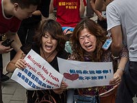 Родственники пассажиров рейса MH370 в Пекине. Август 2015 года  
