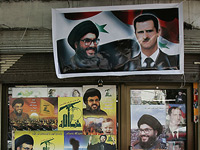 Плакаты с изображениями лидера "Хизбаллы" Хасана Насраллы и президента Сирии Башара Асада в Бейруте