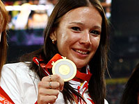 МОК из-за допинга лишил российских бегуний "золота" Олимпиады-2008 в эстафете 4 по 100 метров