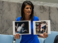 Постпред США в ООН Никки Хейли с  фотографиями жертв химической атаки в Сирии