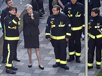 Тереза Мэй на месте пожара у Grenfell Tower, 14 июня 2017 года  