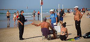 Нельзя, но можно? Солнечный февральский день на пляже в Тель-Авиве. Фоторепортаж